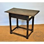 An 18th century and later oak side table, with moulded top and chamfered legs, lacking drawer,