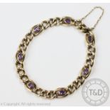 An amethyst set curb link bracelet, the curb link bracelet set with seven amethysts,