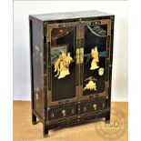 A Japanese inlaid and lacquered cabinet, with two doors, decorated with figures and flowers,