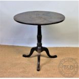 A George III oak occasional table, with circular top, on tripod base, 70cm H x 73.