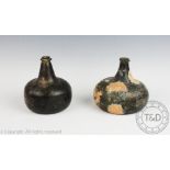 An 18th century onion shaped green glass wine bottle, two chips to the collar, 15cm high,