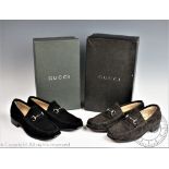 Two pairs of Gucci loafers to include; a black suede pair with snaffle detail, size 35.