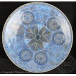 An Art Deco opaline glass bowl in the manner of Lalique, moulded with stylized flowers and leaves,