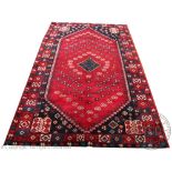 A Persian Shiras hand woven wool carpet,