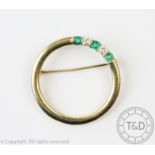 A Tiffany diamond and emerald set brooch,