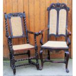 A 17th century style carved oak arm chair, with later caned back and seat, with scroll end arms,