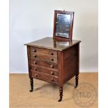 A Victorian mahogany dressing chest, with hidden mirror back above four long drawers,