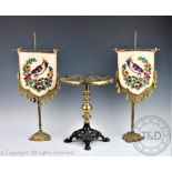 A pair of Victorian gilt brass table screens, with tapestry panels of a bird and flowers, 52cm high,