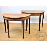 A pair of George III style mahogany 'D' shaped side tables, on tapered legs,