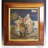 A late 19th century tapestry picture depicting Mary, Joseph and the infant Christ,