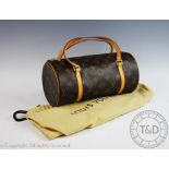 A Louis Vuitton bowling handbag, the circular bag with leather trim and gold tone furniture,