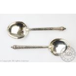 A pair of Indian white metal serving spoons,