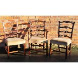 A part set of five George III style mahogany dining chairs, with upholstered seats,
