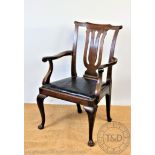 A late 19th century mahogany library chair, with lyre shaped back and drop in seat,