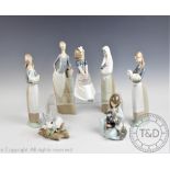 A collection of Lladro and Nao figures, to include; Lladro Girl with Cat and Dog,