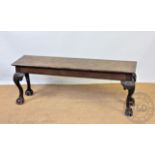An early 20th century mahogany window seat, with rectangular top,