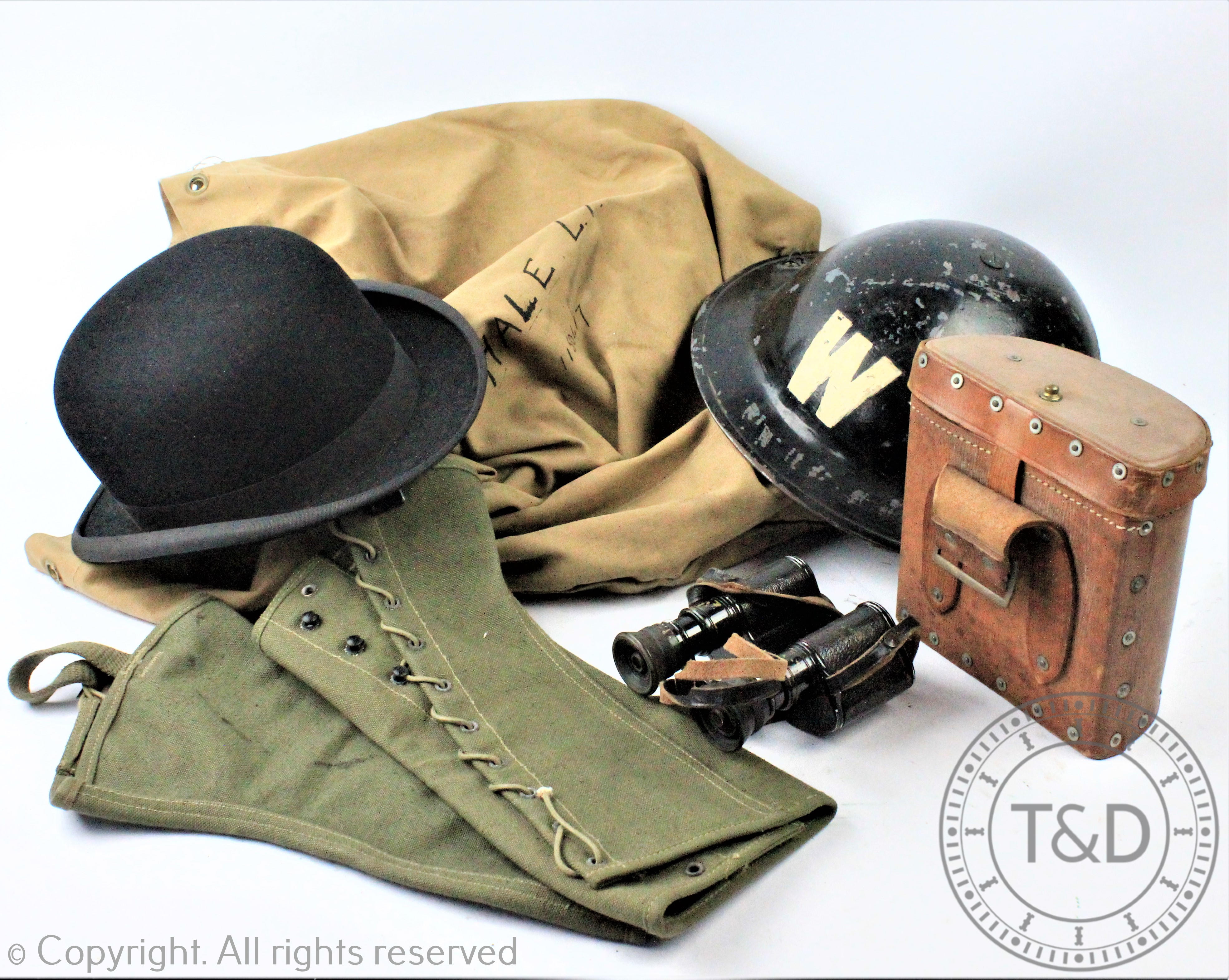 A World War II Wardens helmet, with a pair of 'Lustra' binoculars in leather case,