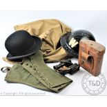A World War II Wardens helmet, with a pair of 'Lustra' binoculars in leather case,