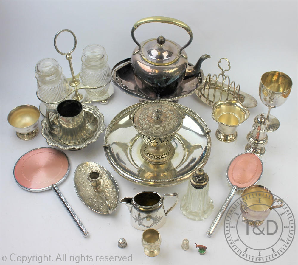 A collection of silver plated wares to include teapots, coffee pots, bread baskets, preserve jars,