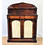 A William IV rosewood chiffonier, with raised shelf back above two glazed doors flanked by columns,