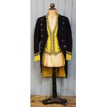 A First Footman livery uniform, comprising tail coat, waist coat and trousers,