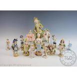A collection of Austrian porcelain figures including Sitzendorf examples,