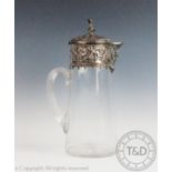 A 19th century Elkington & Co silver plate mounted drinks jug, decorated with cherubs,