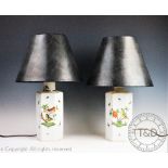 A pair of Herend porcelain hexagonal table lamps, each decorated with birds and insects,