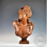A 20th century French plaster bust of a lady, modelled on a square base,