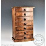 A 19th century style apprentice collectors chest of seven uniform drawers,