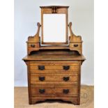 An Edwardian Art Nouveau inlaid oak dressing table,