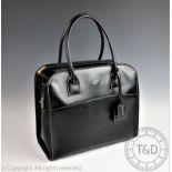 A Tod's black leather and white stitched two handled computer bag,