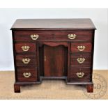 A 19th century and later mahogany kneehole desk,