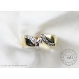 A diamond set dress ring, designed as a central brilliant cut diamond,