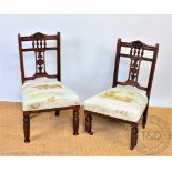 A near pair of Edwardian carved walnut side chairs, with Voyage 'highland cow' upholstery,