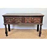 A late 17th century style oak dresser, with moulded top above two Jacobean style fielded drawers,