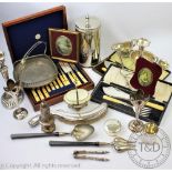 A large assortment of silver plated wares to include a cased ivory handled part canteen,