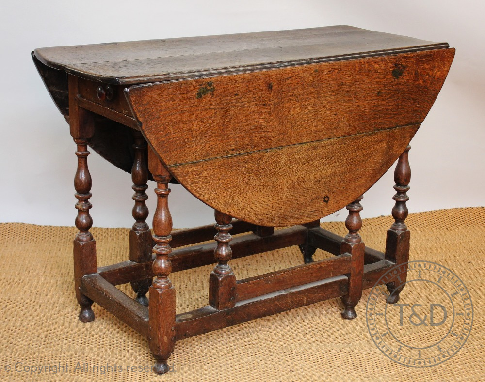 An 18th century oak gate leg table, with drawer, on turned and block legs, - Image 2 of 4