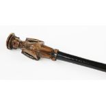 A Folk Art carved walking cane, the terminal carved with a standing portly gentleman,
