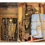 A selection of 19th century and later vintage hand tools and farming accessories,