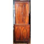 A modern George III style mahogany corner cabinet, with four oval panelled doors, on bracket feet,