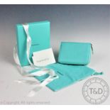A Tiffany & Co leather zip around wallet,