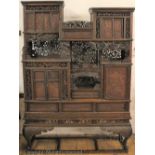 An elaborate Japanese Tansu style carved and brass inlaid wood cabinet, possibly a type of rosewood,