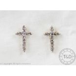 A pair of diamond set cross shaped stud earrings,