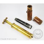 An Arnold & Sons of London brass veterinary syringe, with turned wooden handle,