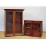 An Edwardian walnut two door display cabinet, no shelves, 92cm H x 69cm W x 34cm D,