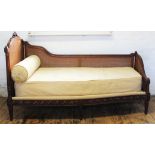 A Louis VI style carved walnut bergere day bed, purchased from Seventh Heaven Beds,