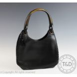 A Gucci black leather whipstitch handbag, with stained wood loop handle,