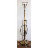 An Art Nouveau brass adjustable oil standard lamp, converted for electricity,