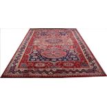A machine woven Tabriz type carpet, worked with three geometric gulls and foliate motifs,
